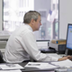 A regular man working at a computer.